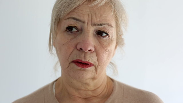 Senior portrait, elderly woman is sad and dissatisfied