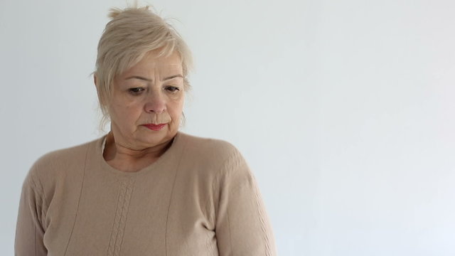 Senior portrait, elderly woman is sad and dissatisfied