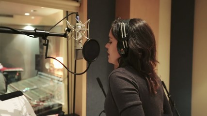 Female singer recording Vocals at Studio - Powered by Adobe