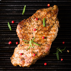 Beef steak on grill top view