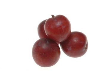 plums isolated on white background