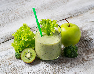 Green smoothie with kiwi, apple, salad and broccoli, healthy dri