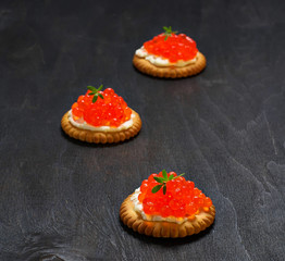 Tartlets with red salmon caviar