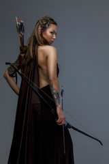 Fighter woman in armor witj bow