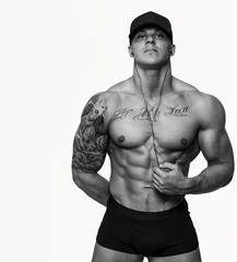 Awesome muscular guy in a cap