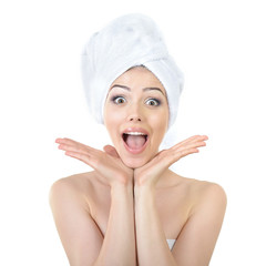 Fresh clean beautiful smiling woman wrapped in bath towels. Heal