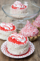 Cake with white air protein cream and red confectionery sprinkle