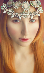 tender portrait of beautiful red haired (ginger) woman with jewe