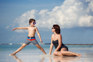 Mother and son on tropical beach