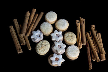 Butter and quince cookies isolated on black.