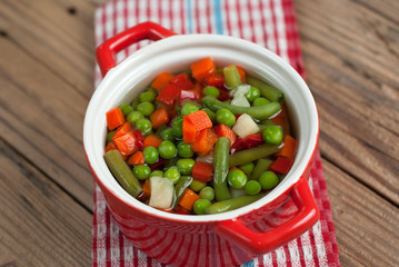 Vegetable soup on old wooden table