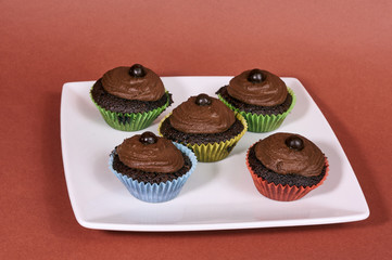 Dessert cookies muffins with cream and chocolate.