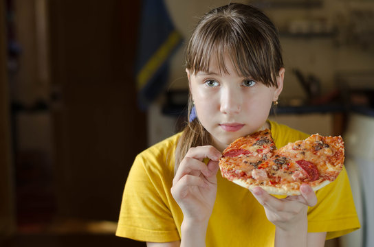 Girl eating Italian pizza