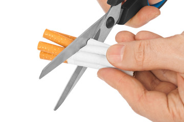 Hand with scissors and cigarettes