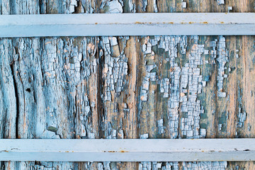 Cracked plywood with an old blue paint