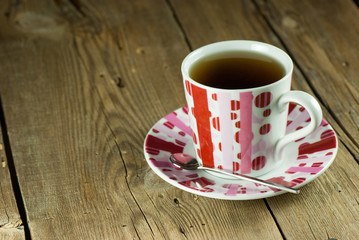 Cup of tea on old wooden table