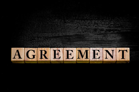 Word AGREEMENT isolated on black background