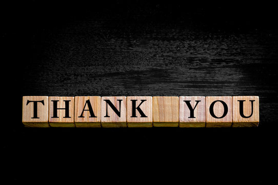 Message THANK YOU isolated on black background