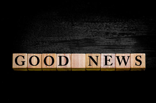 Message GOOD NEWS isolated on black background
