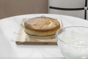 Air delicious biscuit cake with a bowl of cream