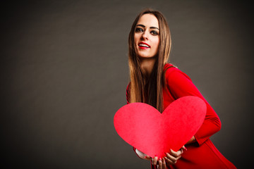 Valentines Day woman holding heart.