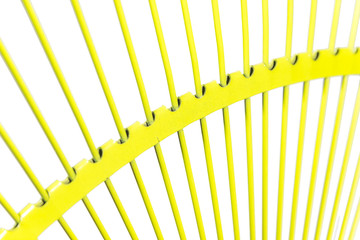 Yellow fan rake isolated white background