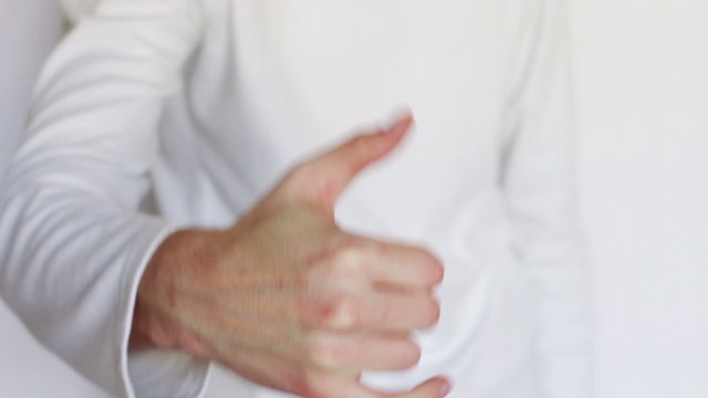 Man shows gestures and signs with his hands.