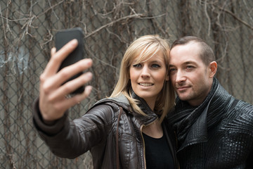 Young CoupleTaking Selfie Smiling