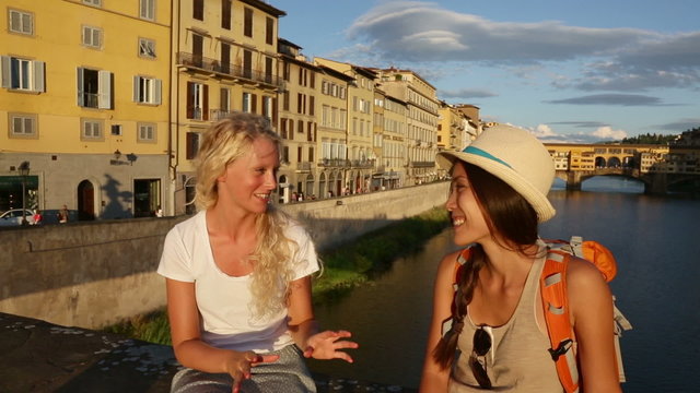 Women girlfriends talking on travel in Florence
