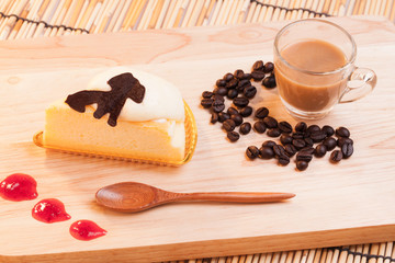 cheese custard cake and cup of coffee on wood.