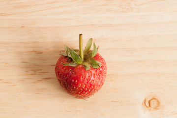 Fresh strawberry on wood.
