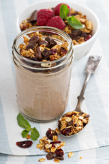 Chocolate smoothie with granola for breakfast