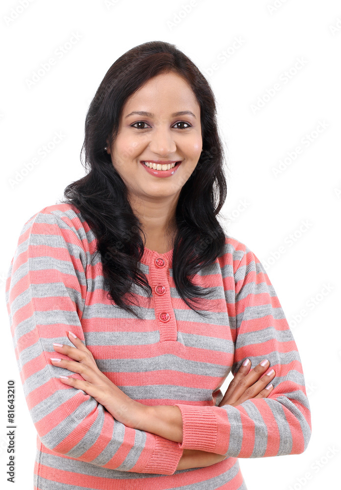 Wall mural portrait of young happy woman standing with arms crossed