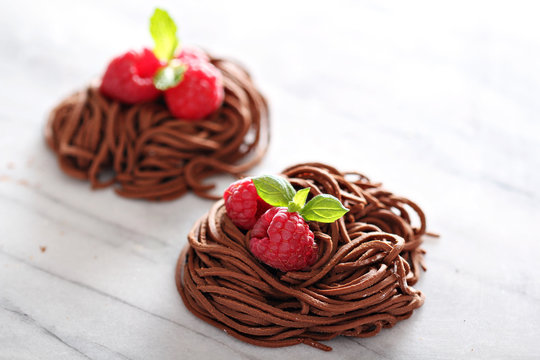 Raw chocolate pasta nests with raspberry