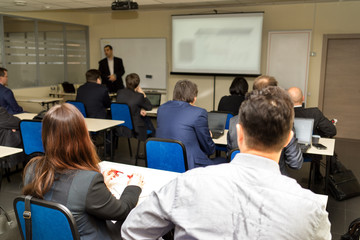 business people group at meeting seminar presentation