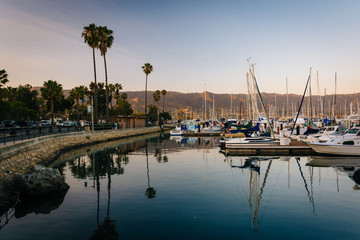 Fototapeta na wymiar Boats in the harbor at sunset, in Santa Barbara, California.