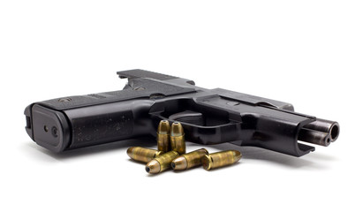 pistol with ammo on white background
