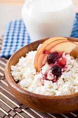 Cottage cheese with apple, berry syrup and sour cream 