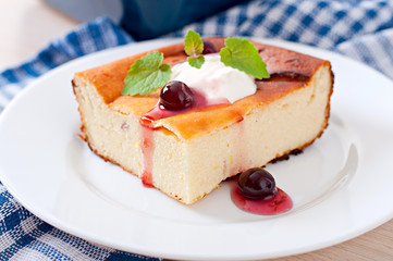 Appetizing cottage cheese casserole on white plate close up