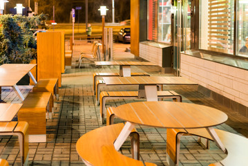 Empty tables of street cafes in  evening
