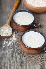 Oatmeal on old wooden table