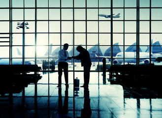 Obraz na płótnie Canvas International Airport Business Travel Airport Handshake Concept