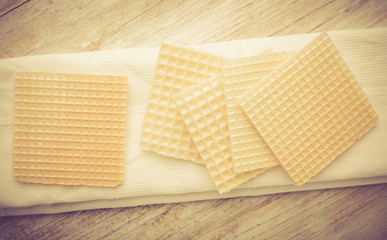 Vintage photo of wafers on white wooden table