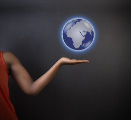 African American woman teacher holding world earth globe