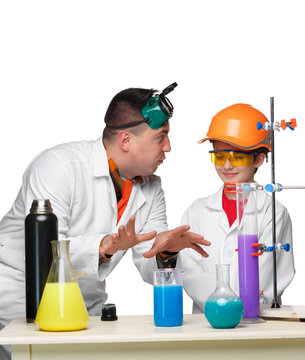 Teen and teacher of chemistry at  lesson making experiments