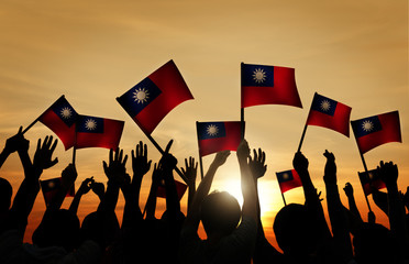 Group of People Taiwanese Flags in Back Lit Concept
