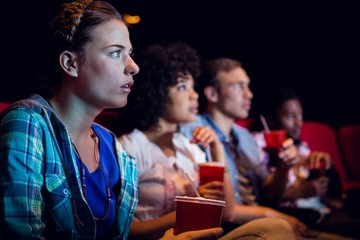 Young friends watching a film