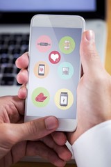 Composite image of businessman using smartphone