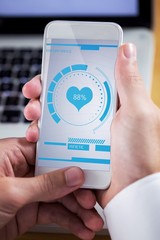 Composite image of businessman using smartphone
