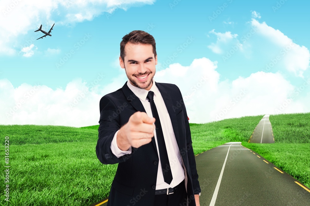 Poster composite image of happy businessman pointing at camera
